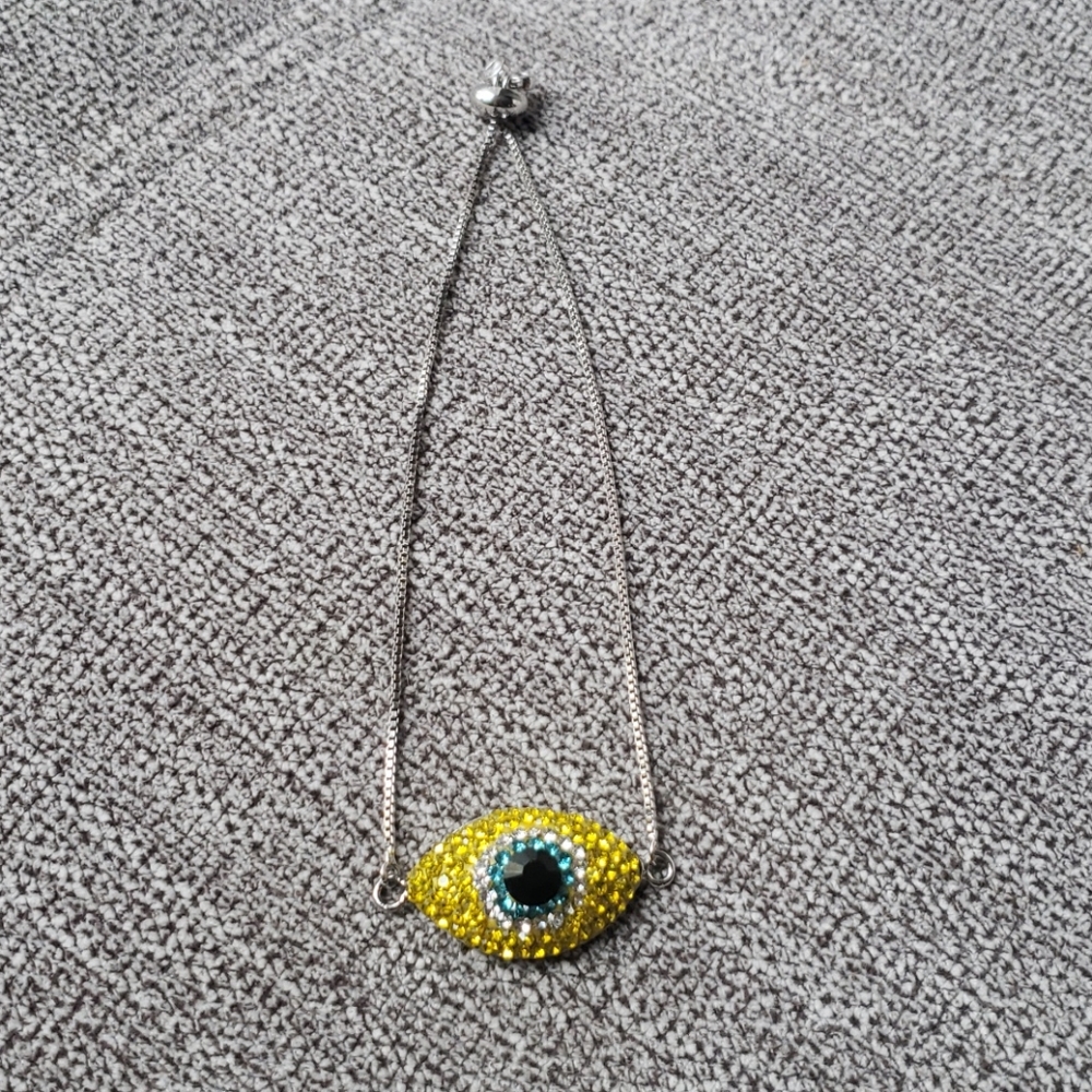 Eye braclet in yellow, pulcera de ojo. Amarillo